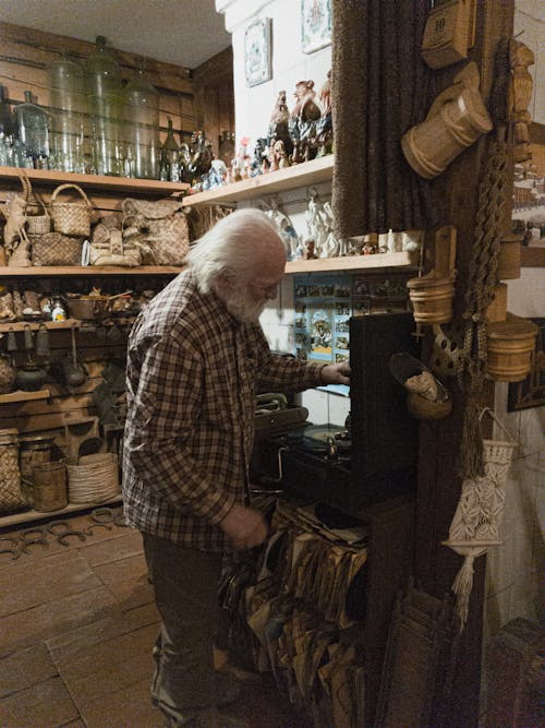 An Elderly Man in an Antique Shop