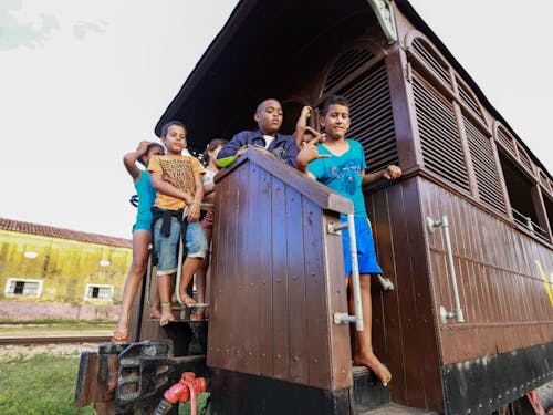 Group of Kids on a Wooden Carriage 