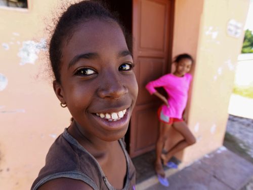 Free Close-up of smiling girls outdoors with a blurred background, showing happiness and youth. Stock Photo