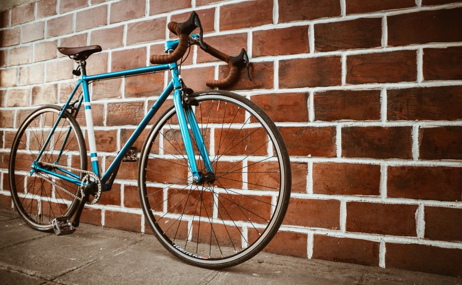 A bicycle parked near an outdoor path