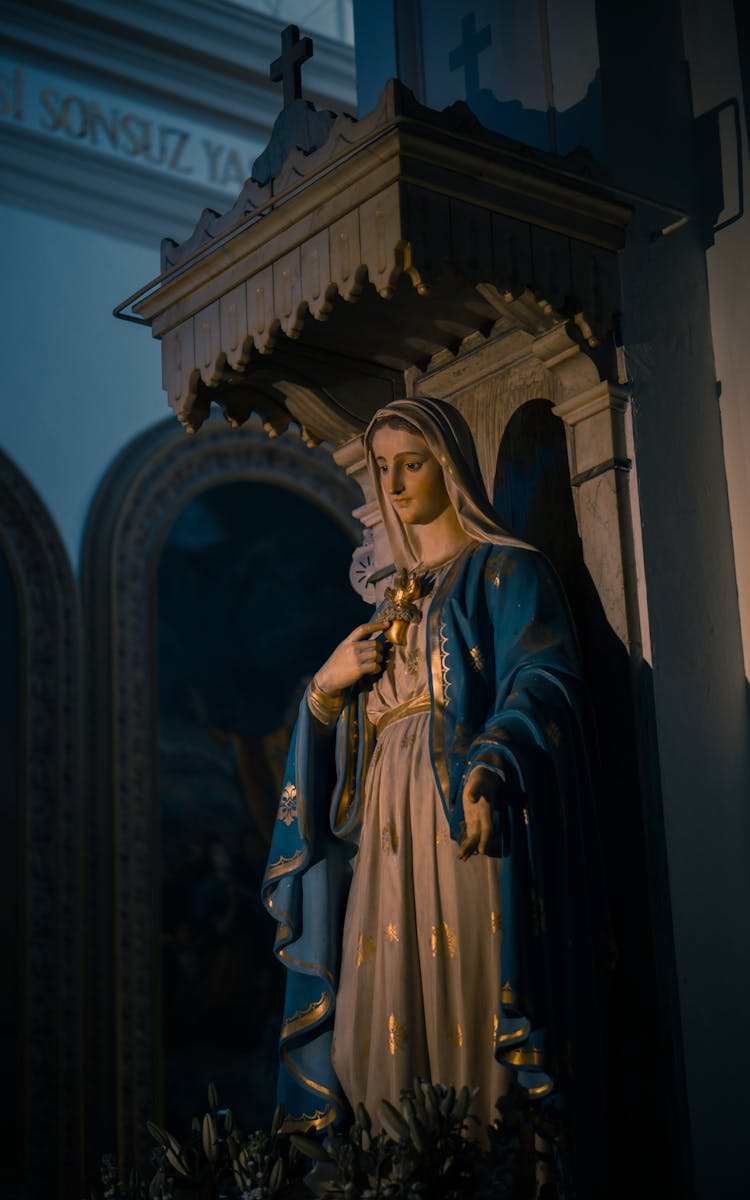 Virgin Mary Statue Beside A Wall