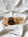 Black Ceramic Mug on Brown Paper