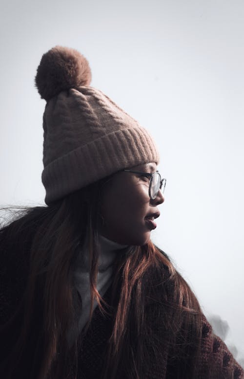 Free Woman in Brown Knit Cap and Sweater with Eyeglasses Stock Photo