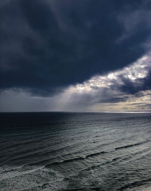 Ocean under the Cloudy Sky