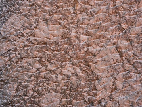 Pink and Brown Granite Wall in Close Up Photography