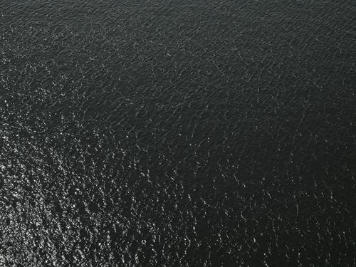 Free High angle view of ocean waves, capturing the natural patterns and textures of the sea surface. Stock Photo