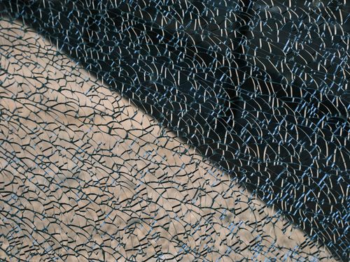 Free Detailed view showing the intricate patterns of cracked safety glass, highlighting unique textures. Stock Photo