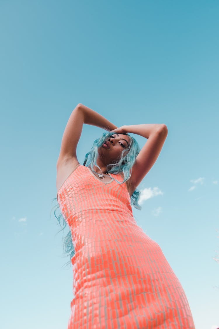 Woman In Orange Dress With Blue Hair