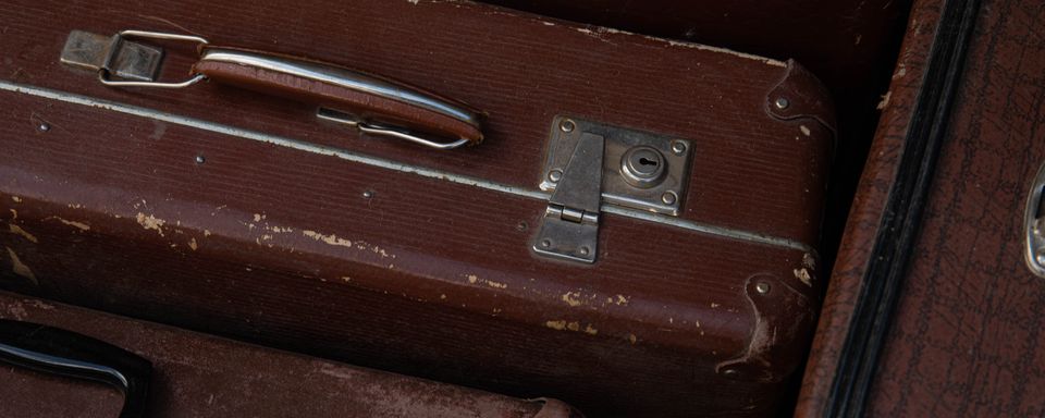 Stacked vintage leather suitcases