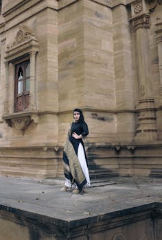 Woman Wearing Black, White, and Brown Shalwar Kameez Dress