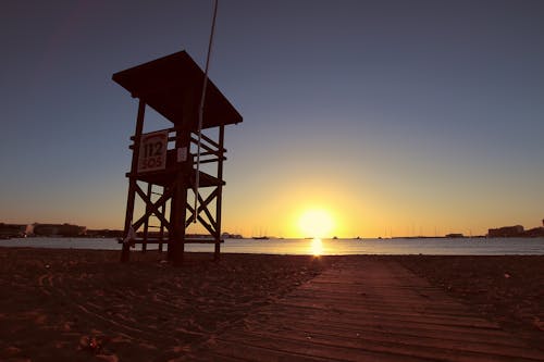Безкоштовне стокове фото на тему «берег моря, вода, Захід сонця»