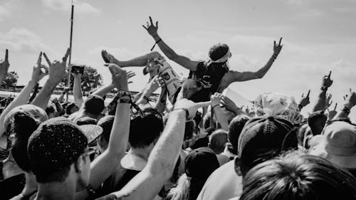 Free Grayscale Photo of People Raising Their Hands Stock Photo