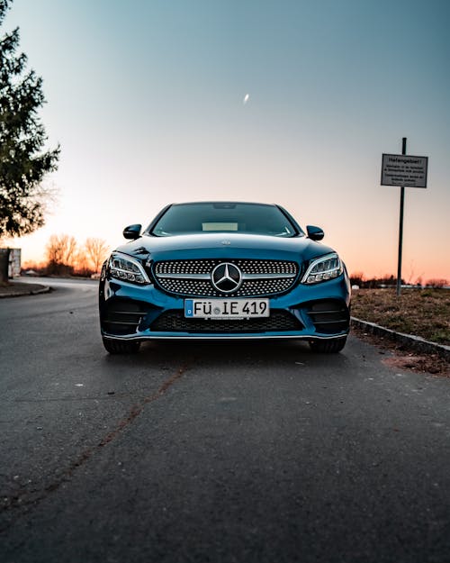 Free Blue Mercedes Benz Car parked on the Street Stock Photo