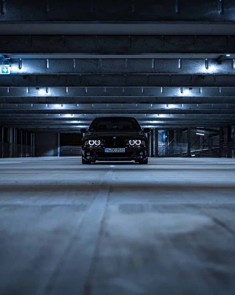 Black BMW Car Parked On A Vacant Parking Lot