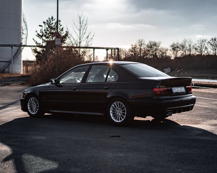 Black BMW Car Parked On A Vacant Parking Lot