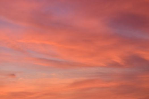 A breathtaking view of the sky during sunset, showcasing vibrant pink and purple hues.