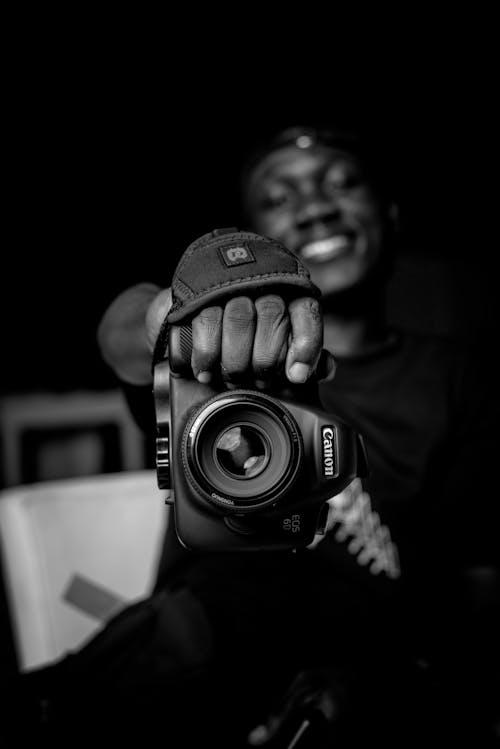 Man Showing Black Camera