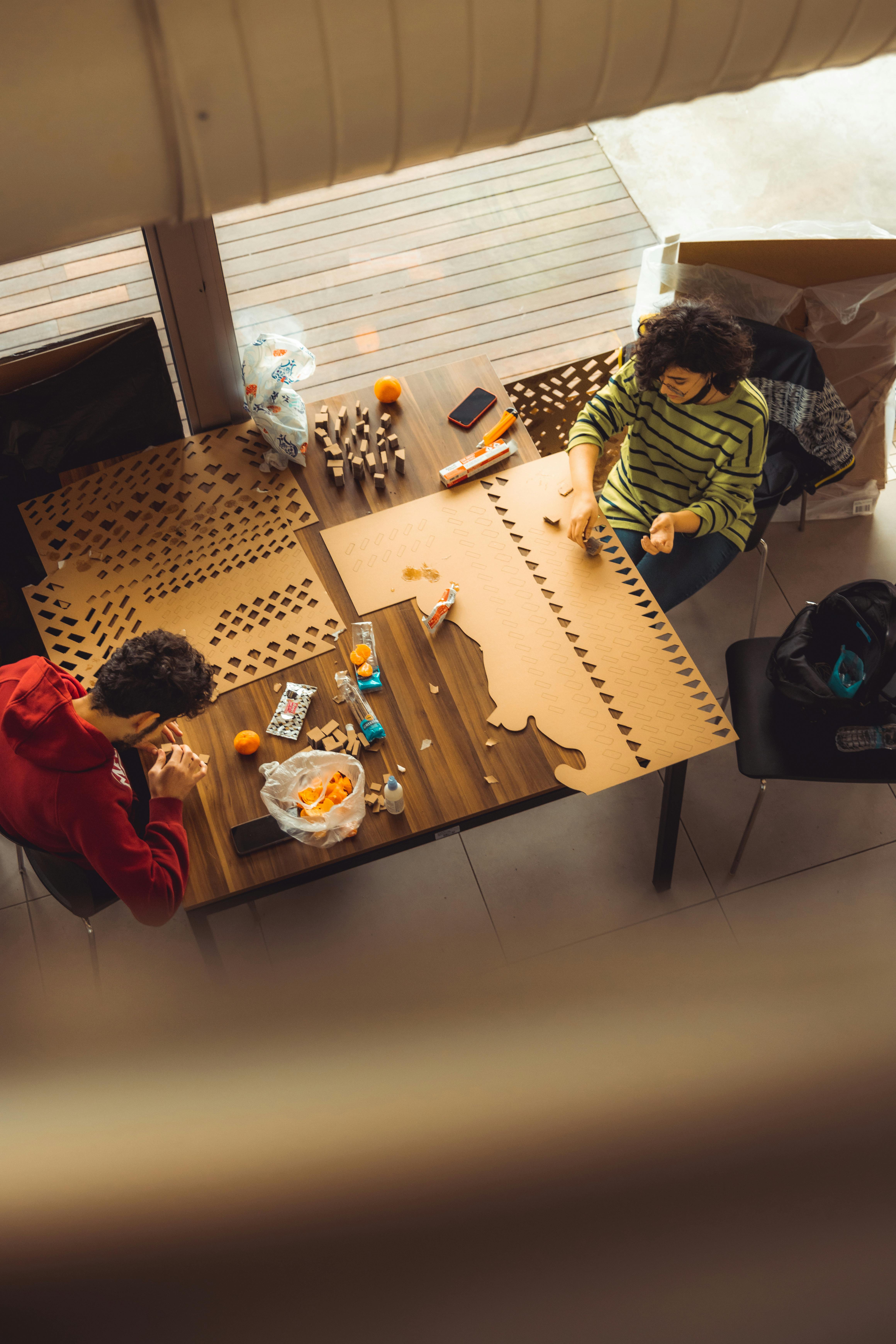 Woman and Man Eating Tangerines · Free Stock Photo