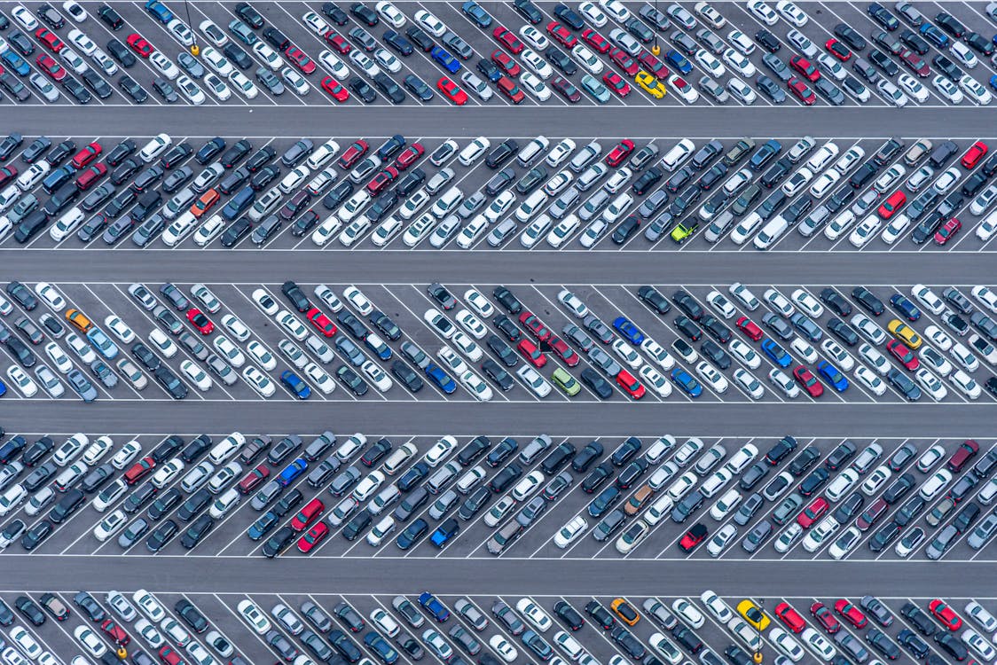 Free Parking Lot of a Car Dealership from Birds Eye View Stock Photo