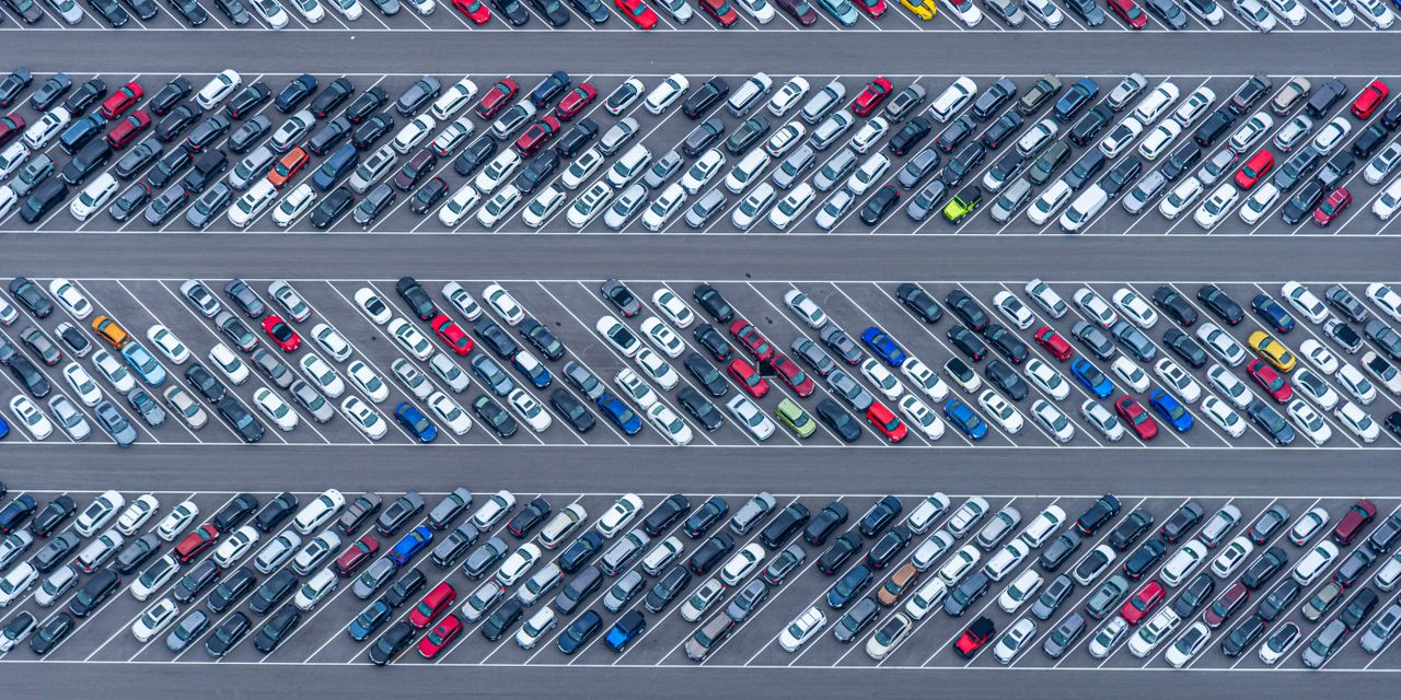High-angle aerial photo showcasing a crowded parking lot filled with diverse vehicles in Florida.