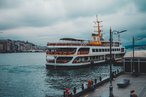 Ferry Boat Dock on a Harbor With Tourist People