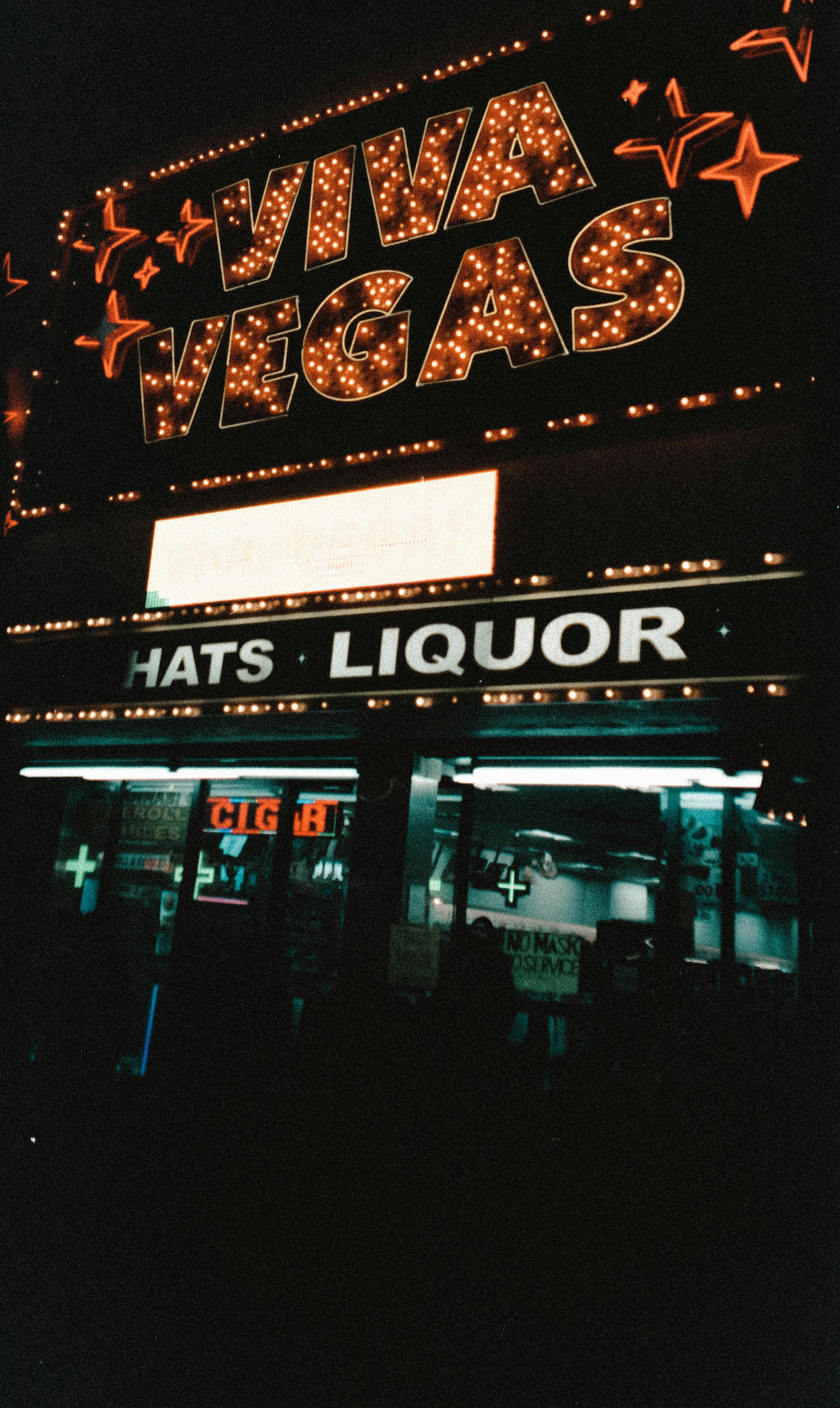 Vibrant neon 'Viva Vegas' sign lighting up a street at night in Las Vegas, Nevada.