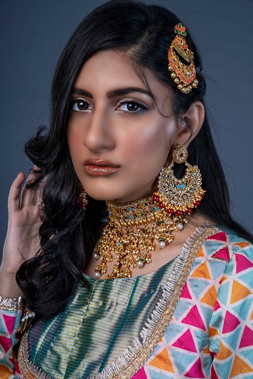 Woman in Traditional Wear with Makeup and Accessories
