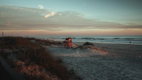 Brown Wooden Lifeguard Tower on Seashore