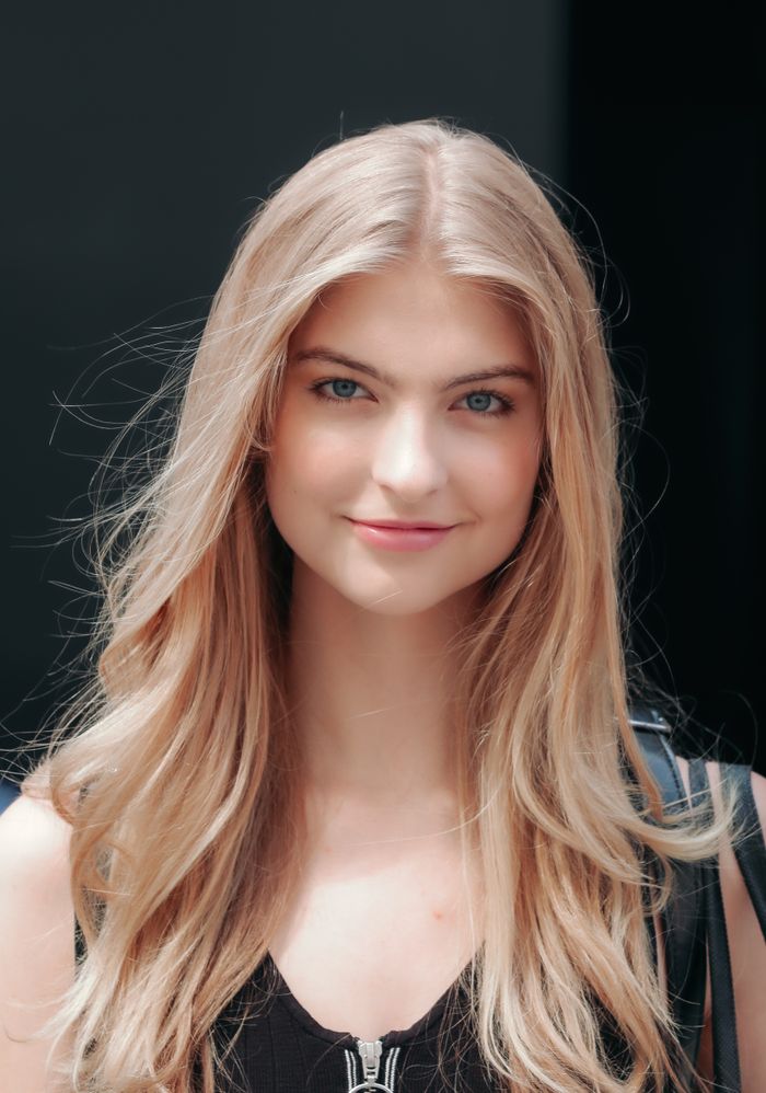 Smiling blonde woman with long healthy straight hair