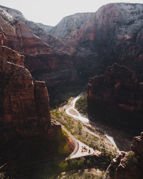 River Between Brown Narrow Canyon