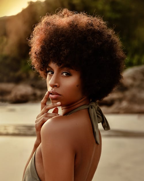 Woman with Afro Looking Over her Shoulder