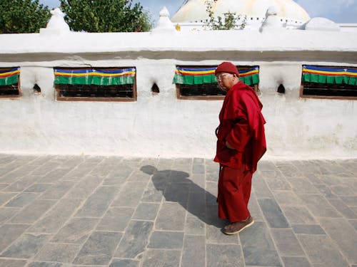 A Monk Standing Outdoors