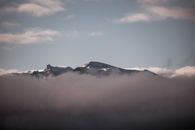 Snow Covered Mountain Under Gray Sky
