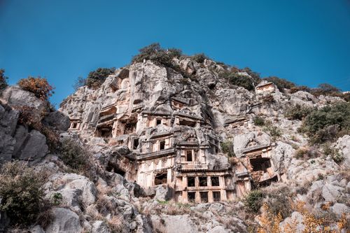 Free Explore the ancient Lycian rock tombs carved into cliffs in Myra, Turkey's historical marvel. Stock Photo