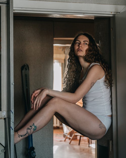 Woman Sitting in the Doorway