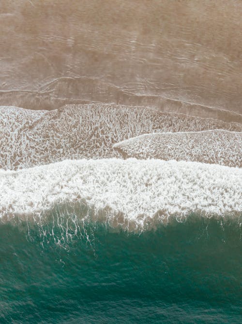 Drone Shot of Waves Crashing on the Shore
