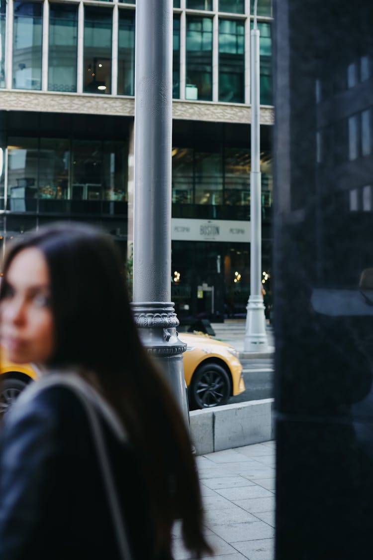 Woman Turning Back In City