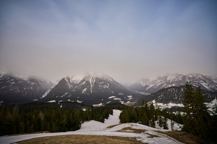 Panoramic View Of Misty Mountains