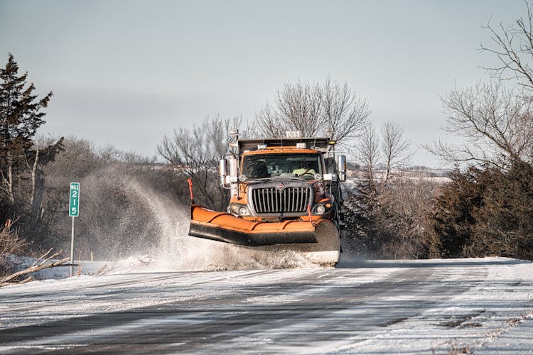 A Winter Service Vehicle Clearing The Road With Snow