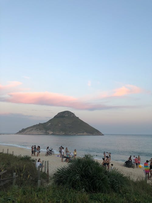 People Enjoying the Day on a Beach