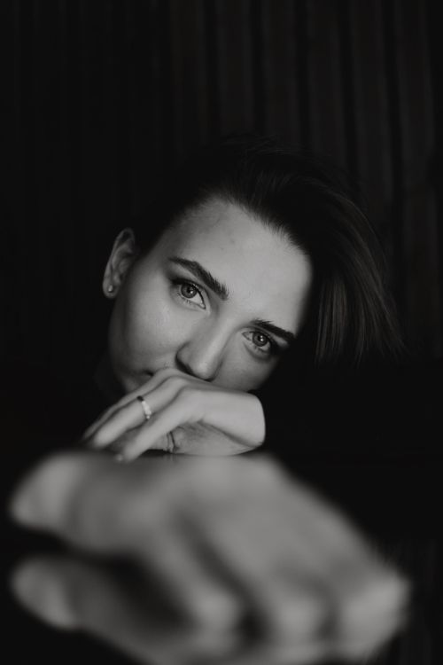 Free Dramatic black and white portrait of a woman with a contemplative expression. Stock Photo