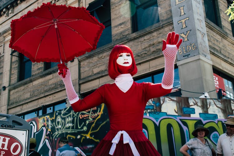 Woman Holding Red Umbrella