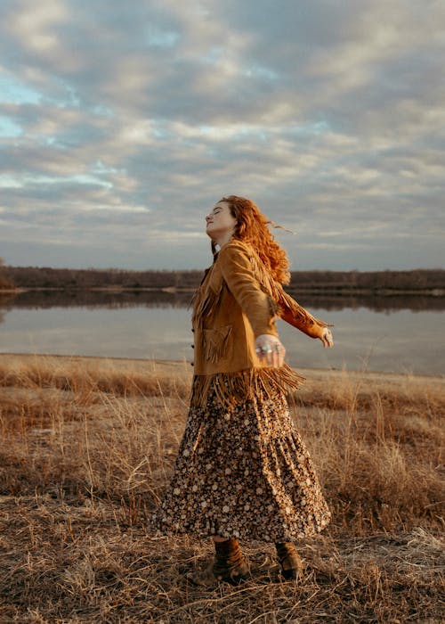 Ginger Woman Dancing in Open Field