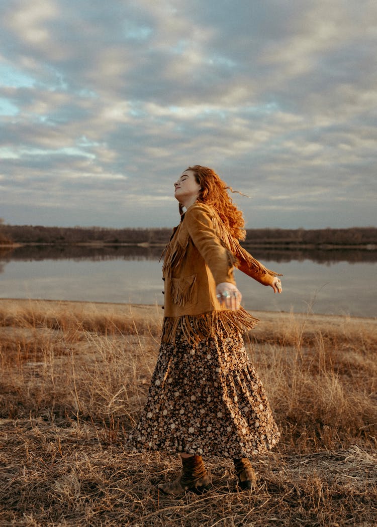 Ginger Woman Dancing In Open Field