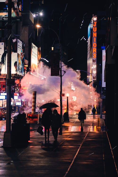 Cloud of Smoke Covering City Street at Night