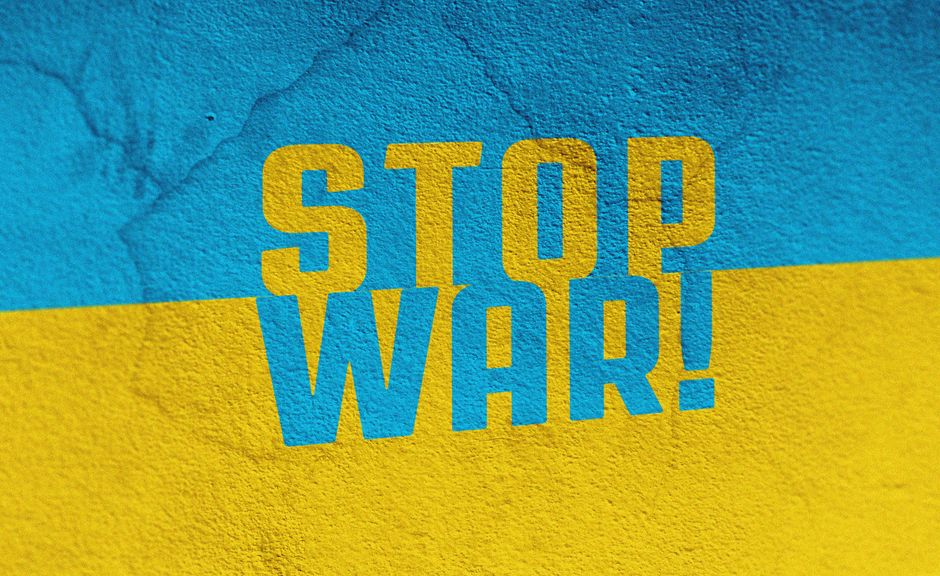 Vibrant mural displaying the 'Stop War' message painted on a textured wall in Czechia.