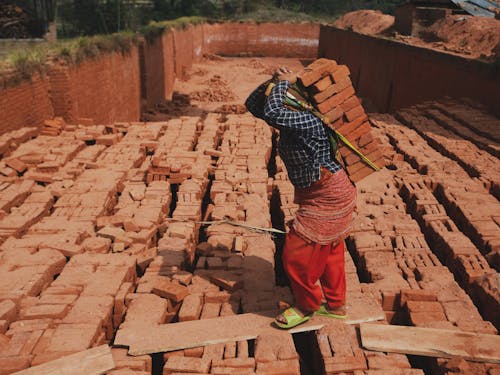 A Woman Carrying Bricks