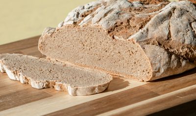 Rustic rye loaf on a chopping board. Photo by Frank Schrader on Pexels