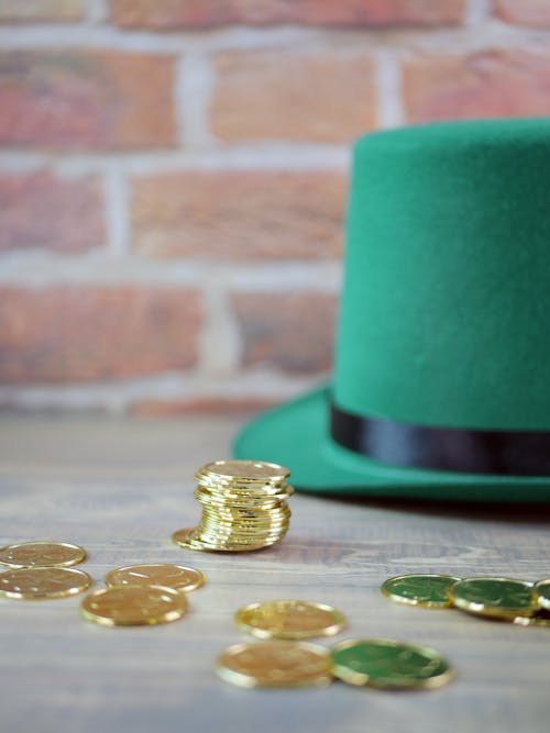 Free Gold Coins on Green Round Container Stock Photo