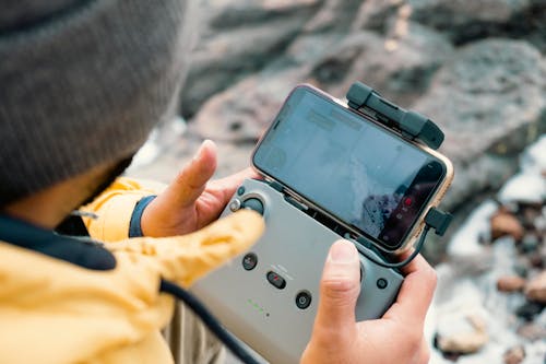 Filmmaker Looking at Drone Recording